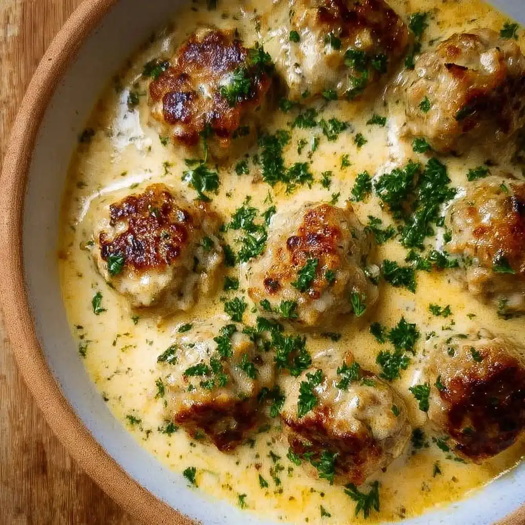 Keto turkey meatballs in creamy sauce served on a plate