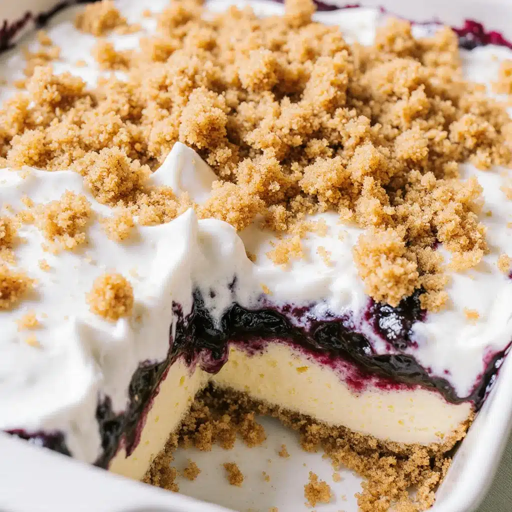 No bake lemon blueberry dessert served in a glass dish topped with fresh berries