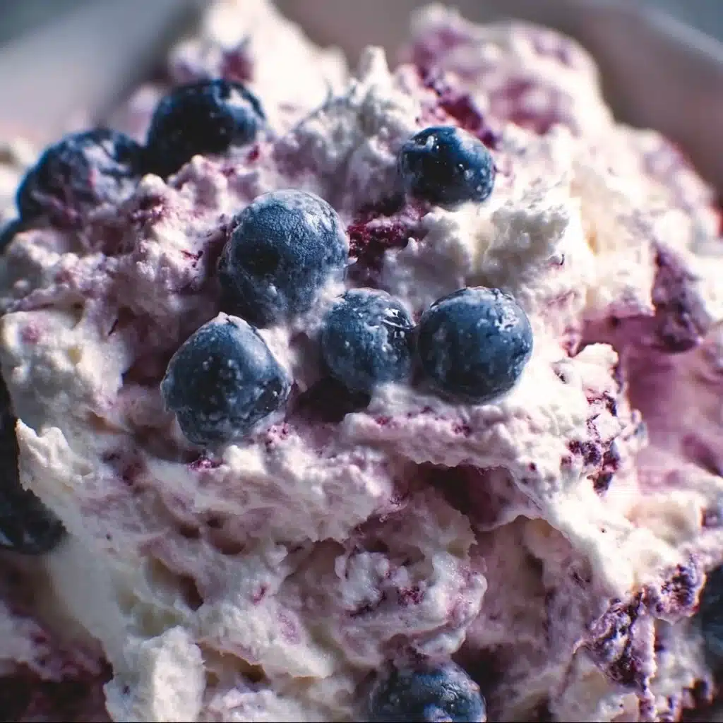 Delicious Blueberry Fluff Salad with whipped cream and blueberries